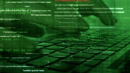Hacker hands typing on laptop keyboard at work with graphic user  interface around