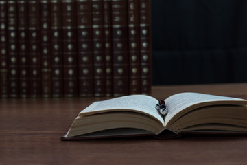 open book on a wooden table