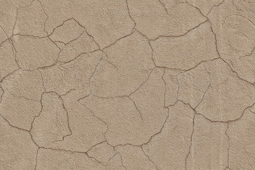 Cracked beige cement plaster. Seamless pattern. Abstract trendy modern texture background