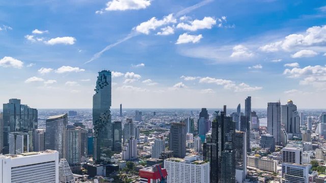 Bangkok business district city center above Silom area, with cloud pass over buildings and skyscrapers, zoom out � Time Lapse