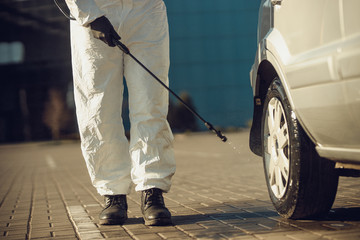 Cleaning and Disinfection of vehicles amid the coronavirus epidemic Car cleaning and disinfection Infection prevention and control of epidemic Protective suit and mask