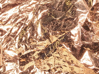 Golden shiny metallic texture. The background photo.