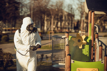 Cleaning and Disinfection on the playground in the sity complex amid the coronavirus epidemic Teams...