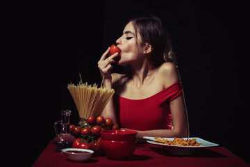 Young woman eating tasty italian pasta, spaghetti.