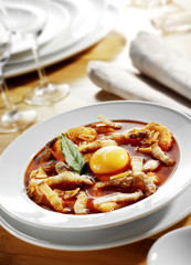 traditional spanish recipe of soup with egg served on table