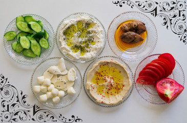 Arabic breakfast, Syrian food, healthy breakfast that includes legumes and chickpeas, milk, packed, cucumber, olive oil