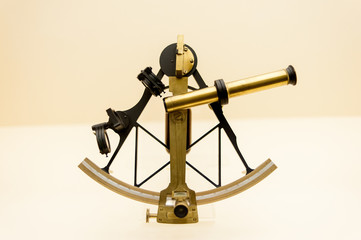 ancient astronomical sextant in gold color