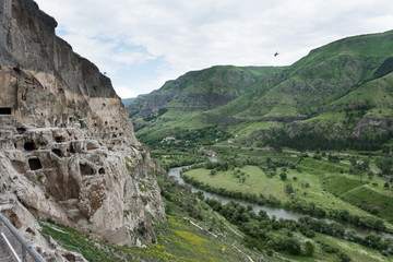 Fototapeta na wymiar Vardzia cave monastery site excavated from Erusheti Mountain on left bank of the Mtkvari River, near Aspindza, Georgia