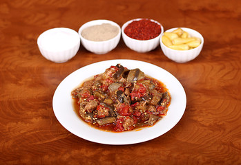 very nice stew with eggplant tomatoes and Turkish spices on a white plate
