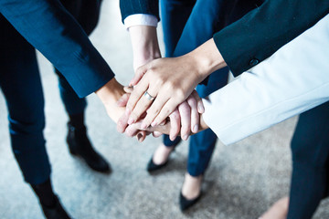 Cropped shot of women putting hands together in circle. Closeup shot of female hands. Teamwork concept