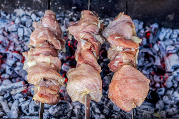 raw pork kebab, sshashlik or kebab, skewer, on the grill closeup