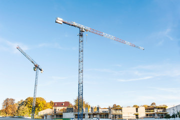 Fototapeta na wymiar High cranes on the construction site