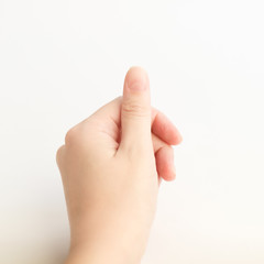 Close up woman hand with nails form of soft square holds something in fingers. Female keeps virtual object. Nail care at home.