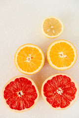 Half of grapefruit, orange, lemon cut for fresh juice. Color splash. Tropical fruits
