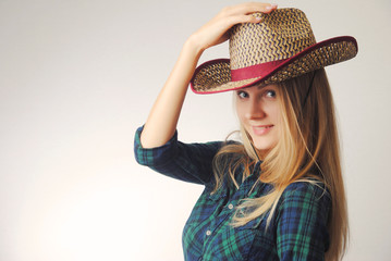 smiling blonde girl in cowboy hat