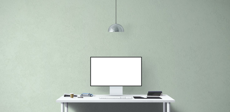 New computer display and office tools on desk. Blank desktop computer screen. Modern creative workspace background. Front view.