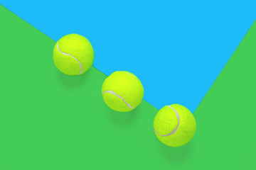 tennis balls line pattern on a blue and green background, copy space