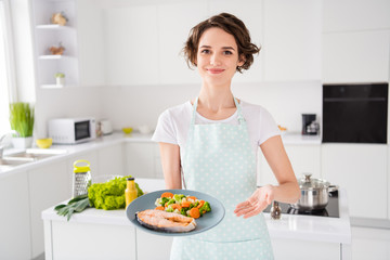 Obraz na płótnie Canvas Have your gastronomy masterpiece, Photo of housewife lady chef showing grilled salmon trout fillet steak roasted garnish cook dinner one person portion wear apron modern kitchen indoors