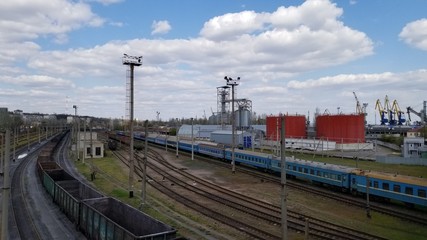 Fototapeta na wymiar A line of railroad train tanker cars. Industrial Zone. empty wagons. Point on top