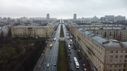 Obraz premium Saint Petersburg cloudy architecture city road street parking panorama Moskovsky prospect passing cars tall houses