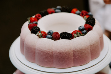 Obraz na płótnie Canvas delicious wedding cake with berries