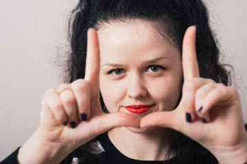 girl doing hand frame