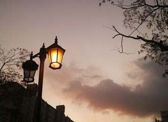a street lamp shining at night