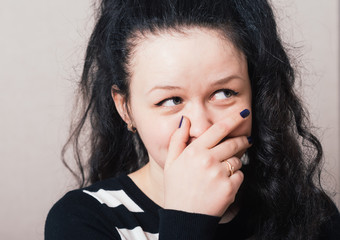 Girl shocked hand to her mouth. Isolated on a white background