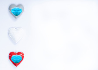Colored hearts with face mask with copy space
