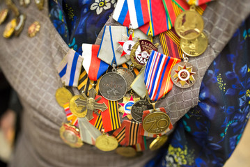 Fototapeta na wymiar Victory Day. Orders and medals on the chest of a veteran. Close-up.