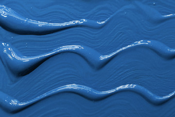 Paint applied thick strokes textured canvas surface. Classic Blue color of the year 2020