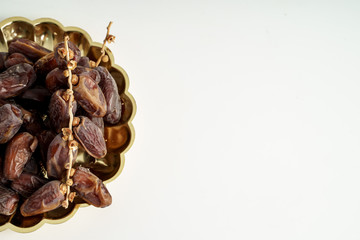Dates fruit on white background. Medjool dried date palm fruits