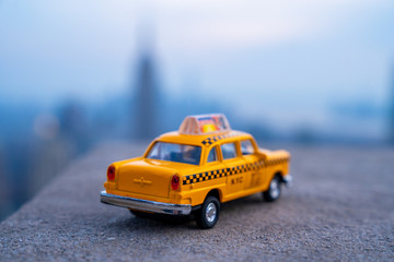 Yellow taxi cabs ride throguh New York City, USA. Taxi symbol.