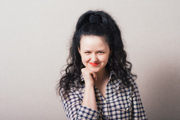 Beautiful young attractive woman  holding her chin