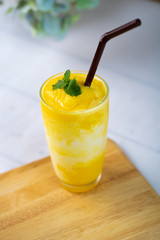 Mango, yogurt in a glass