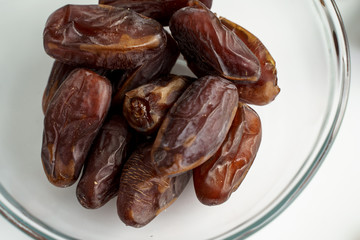Dates fruit on white background. Medjool dried date palm fruits