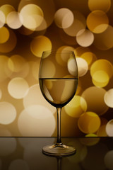 A glass of wine against the background of lights