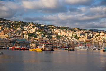 Fototapeta na wymiar Panoramic view of Genoa and its port seen from the sea.