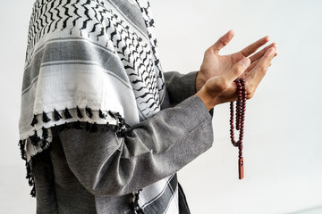 gesture of hand pray in islamic culture couting on prayer beads