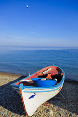 Fishing boat waiting on the beach. Gallipoli, Canakkale / Turkey.