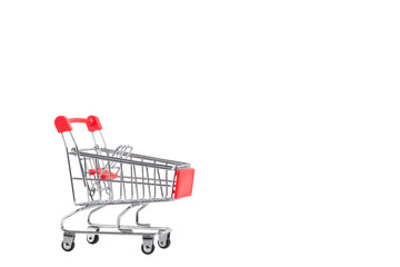 A Shopping Cart. Mini shopping trolley, isolated on white background. Mini Shopping Cart On The Table. Business , e-commerce concept.