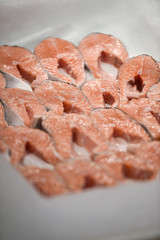 Detail with fresh salmon fillet on ice in a supermarket