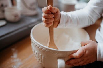  kids hands mixing dough