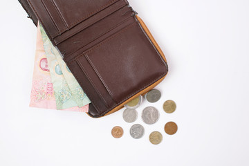 Thai currency banknote 100 baht, 40 baht in wallet and Thai coins on white background, Lack of financial liquidity                                