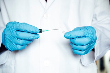 Nurse's hand preparing the coronavirus vaccine