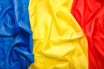 Romania flag background. Romanianational flag as symbol of democracy, patriot. Closeup texture Romanian Flag. Stock photo