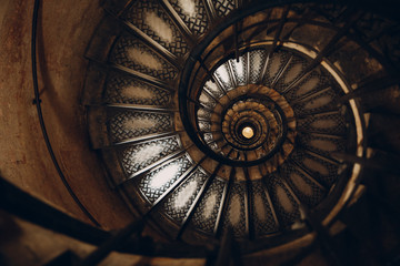 Spiral staircase and human hand