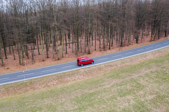 A Red Car On A Street From Above