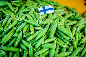Green peas with Finnish flag on local food market in Helsinki, Finland