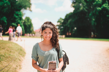 woman with a bag in park © Александра Коробкова